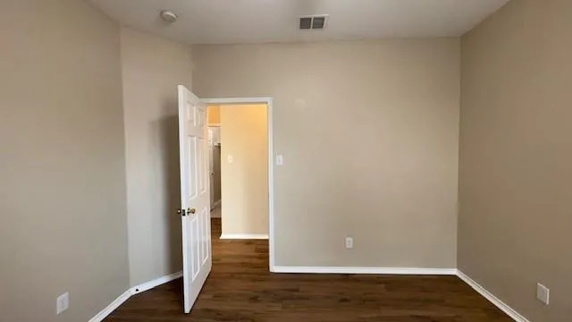 a bathroom with a tub a sink and a large mirror