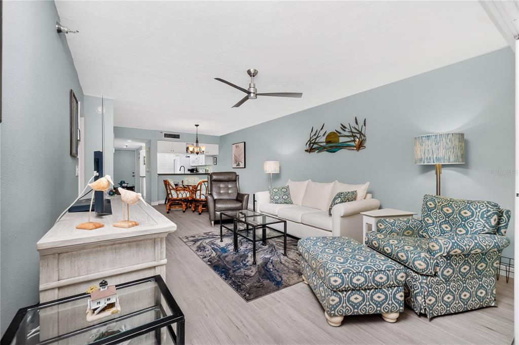 1501 Beach Road, Unit 210 Englewood, FL 34223 - Photo 15 of 62 a living room with furniture and wooden floor