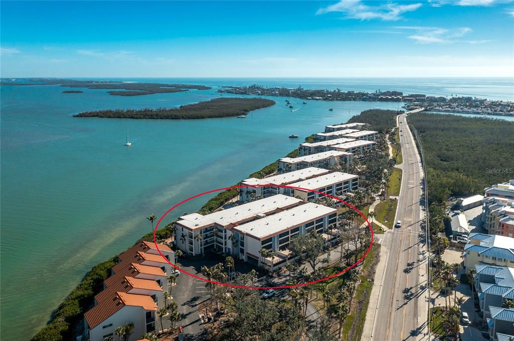 1501 Beach Road, Unit 210 Englewood, FL 34223 - Photo 2 of 62 a view of a lake with a yard