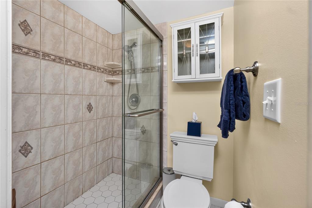 1501 Beach Road, Unit 210 Englewood, FL 34223 - Photo 28 of 62 a bathroom with a toilet and a shower