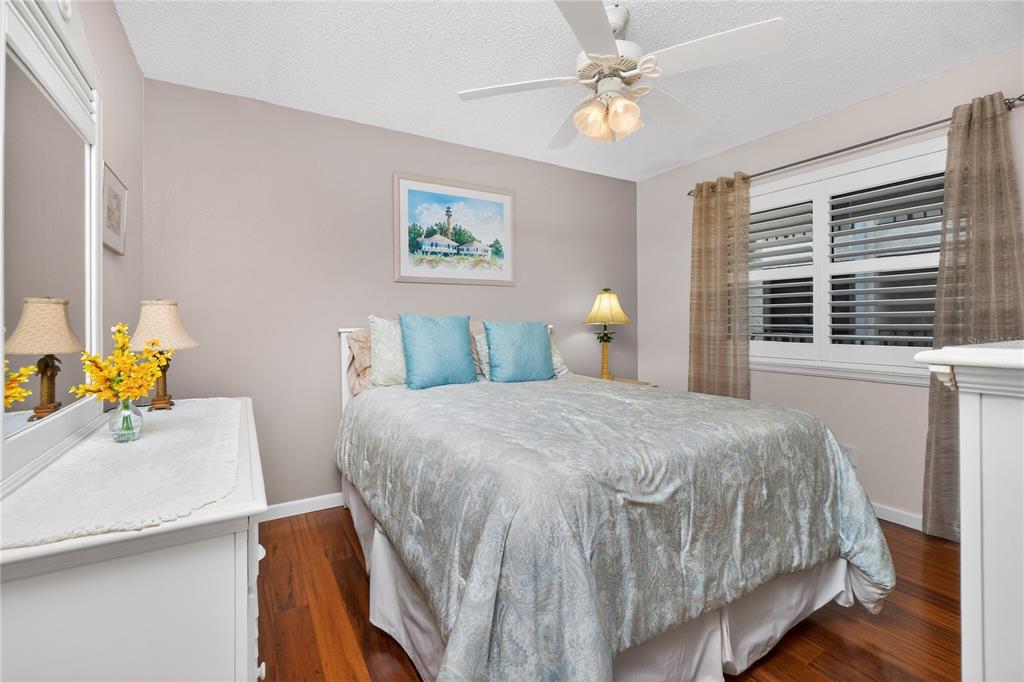 1501 Beach Road, Unit 210 Englewood, FL 34223 - Photo 29 of 62 a bedroom with a bed and a table