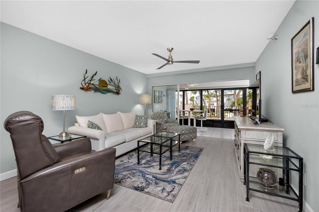 1501 Beach Road, Unit 210 Englewood, FL 34223 - Photo 3 of 62 a living room with furniture a couch and a window