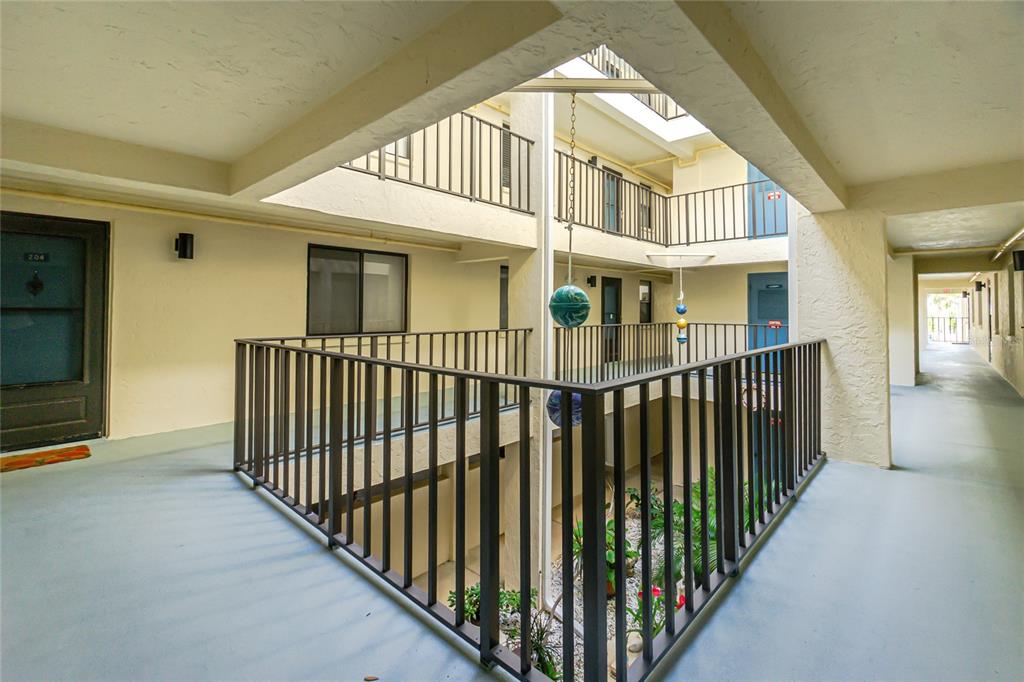 1501 Beach Road, Unit 210 Englewood, FL 34223 - Photo 34 of 62 a view of a brick house with wooden fence