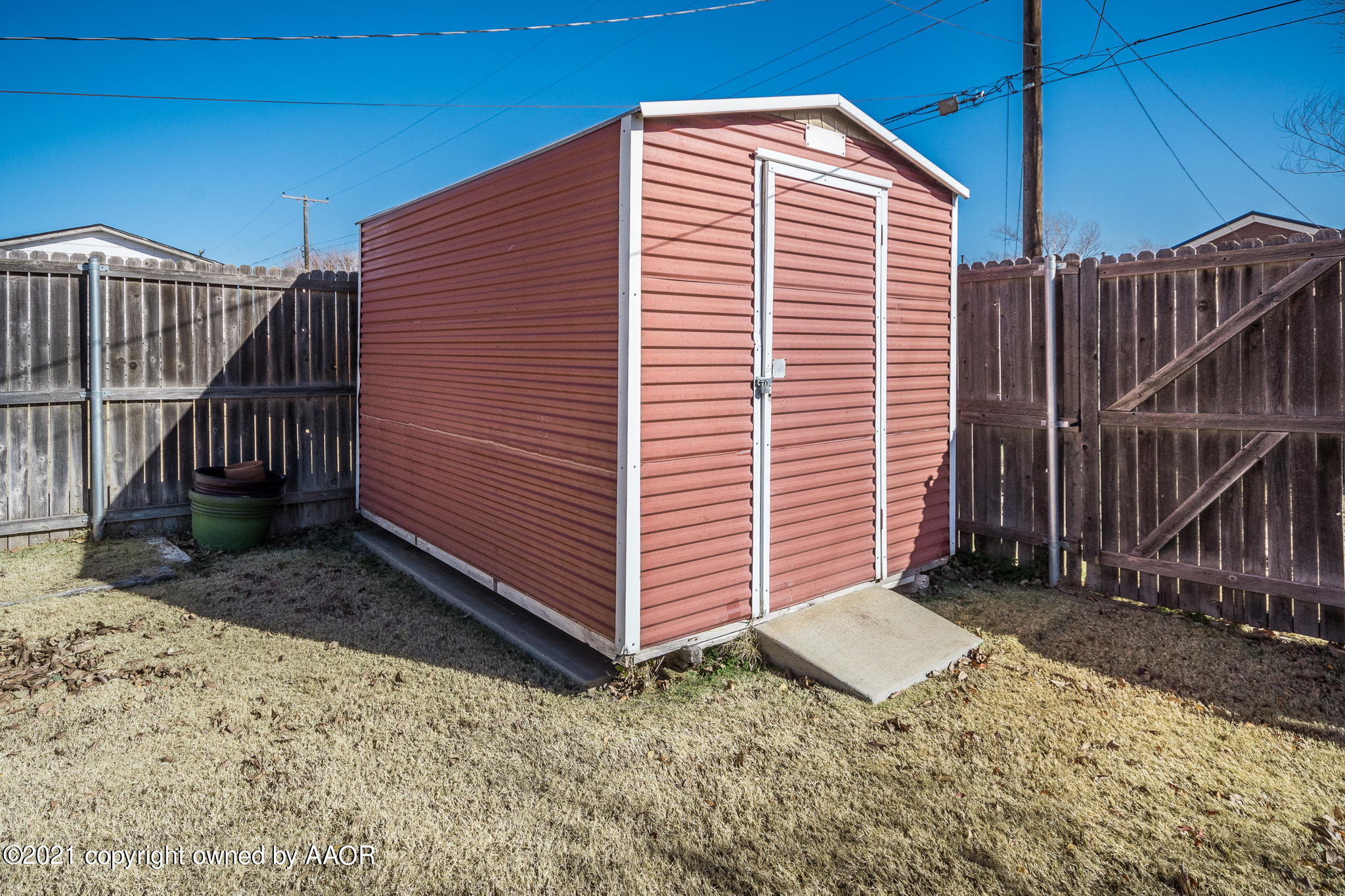 4809 South Rusk Street Amarillo, TX 79110 - Photo 15 of 17 a front view of a house with a yard