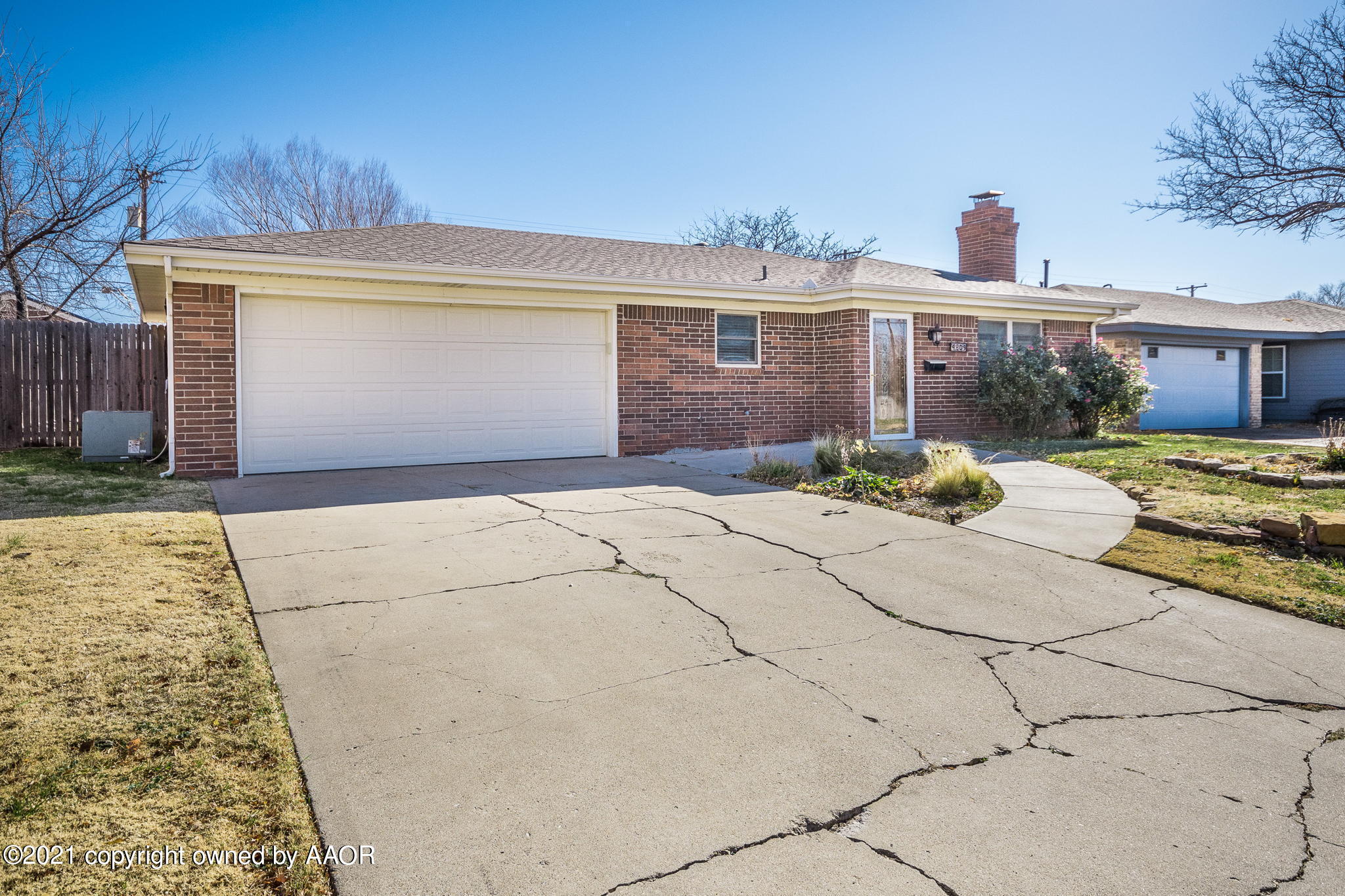 4809 South Rusk Street Amarillo, TX 79110 - Photo 17 of 17 a front view of a house with a yard