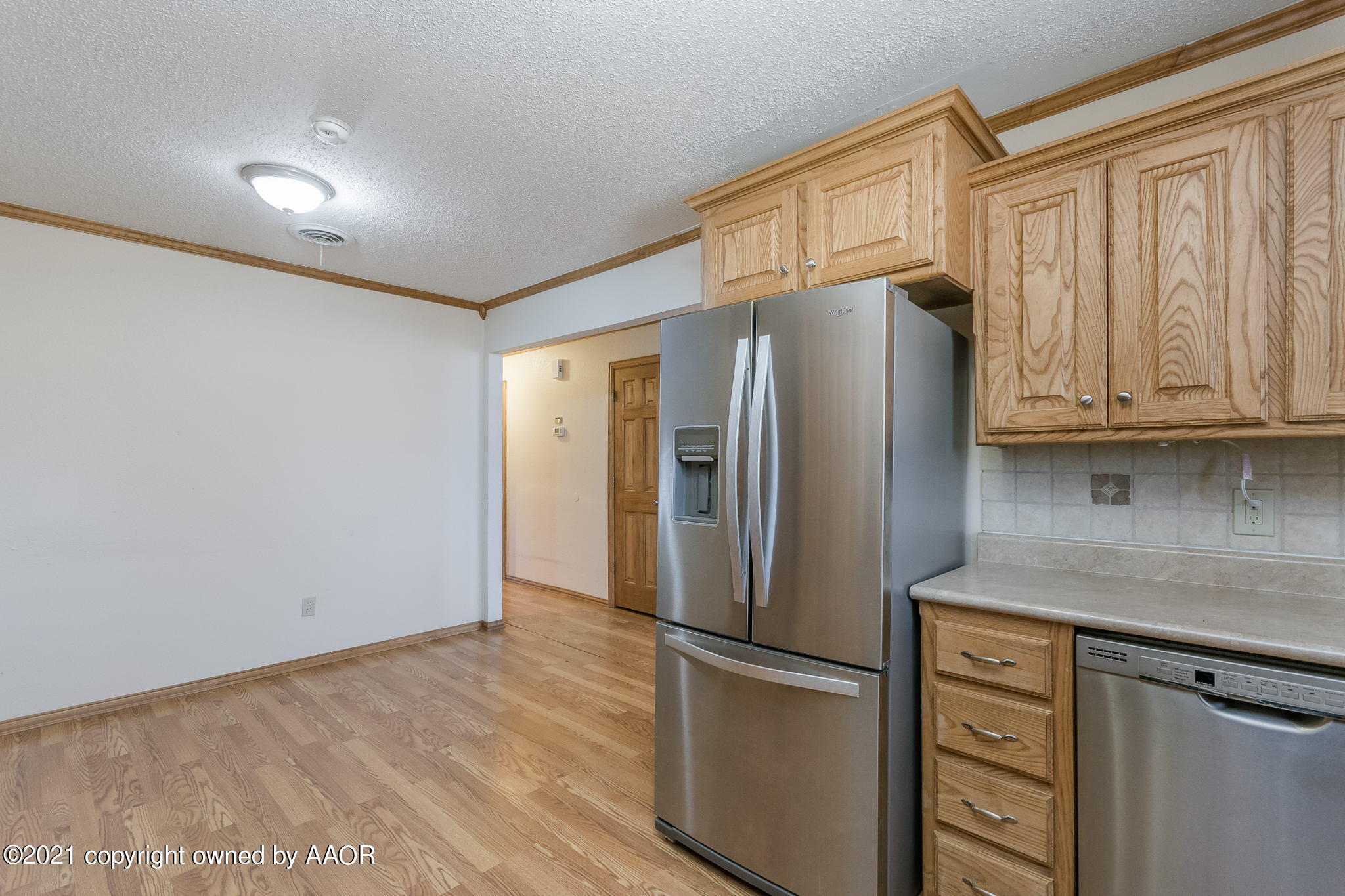 4809 South Rusk Street Amarillo, TX 79110 - Photo 5 of 17 a kitchen with stainless steel appliances granite countertop a refrigerator and a stove top oven