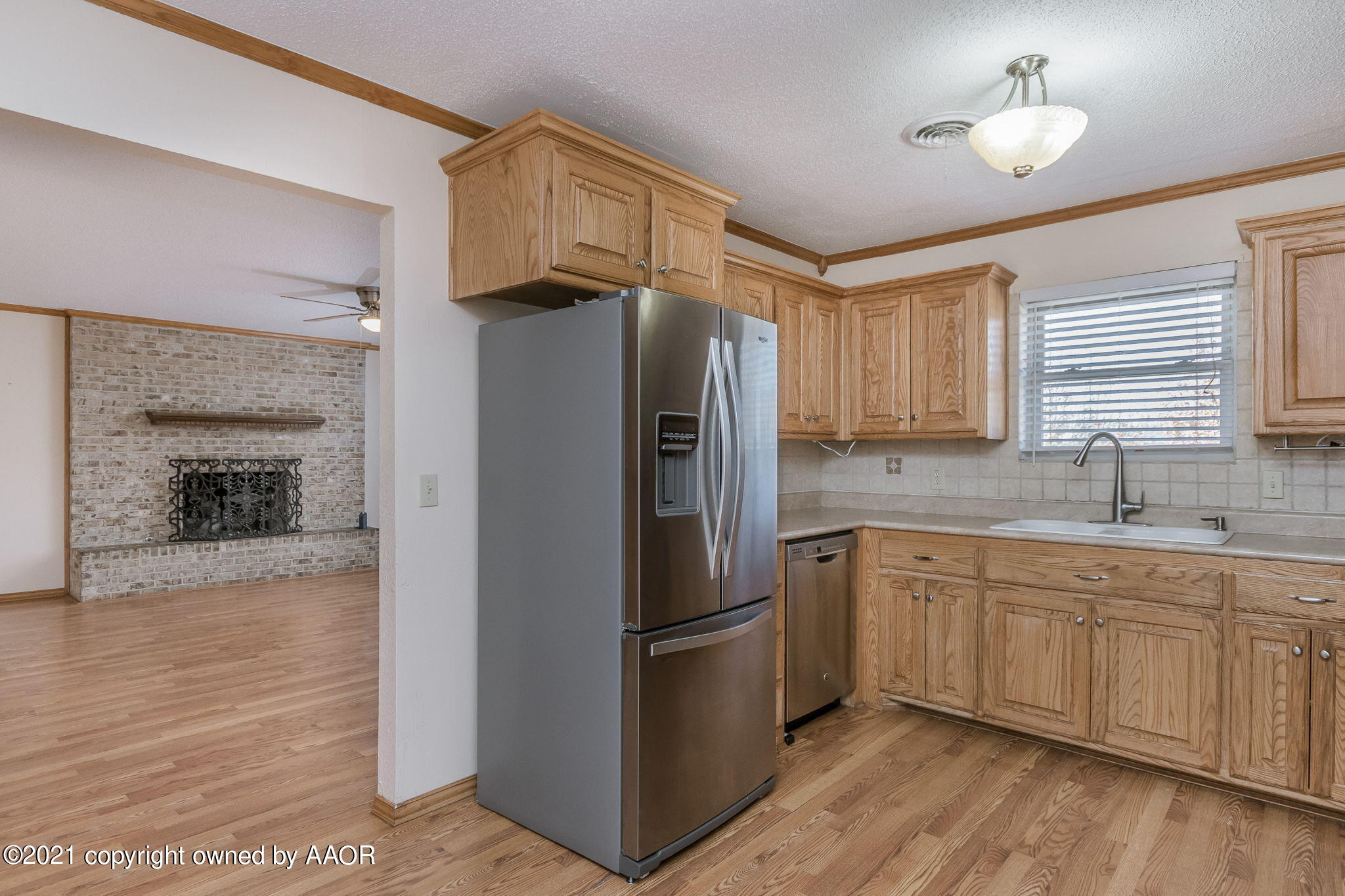 4809 South Rusk Street Amarillo, TX 79110 - Photo 6 of 17 a kitchen with stainless steel appliances a refrigerator sink and cabinets