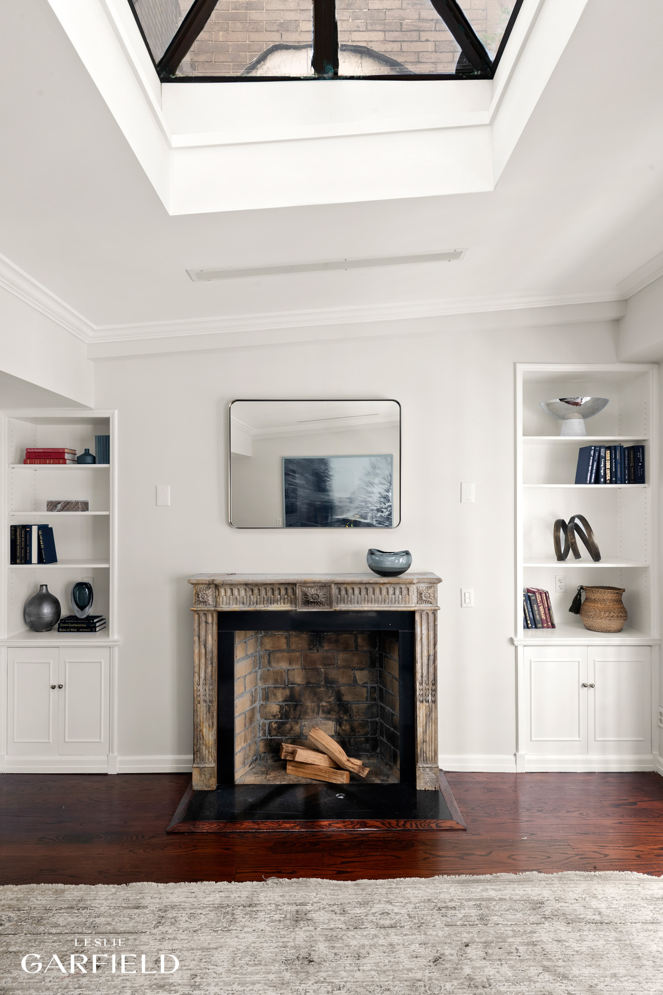 2 East 80th Street, Unit 7 Manhattan, NY 10075 - Photo 11 of 23 a living room with furniture and a fireplace