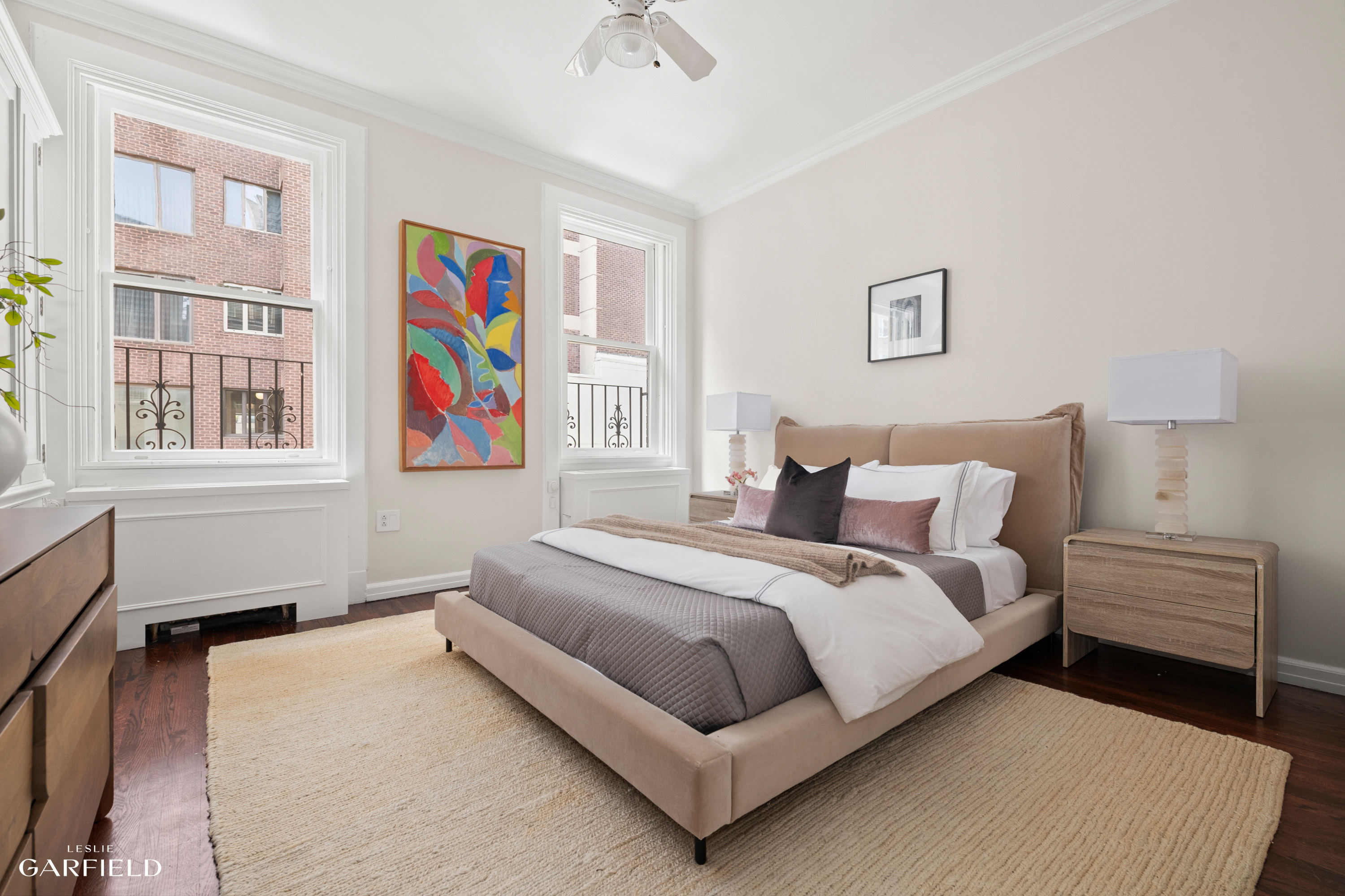 2 East 80th Street, Unit 7 Manhattan, NY 10075 - Photo 16 of 23 a bedroom with a bed wall painting and a window