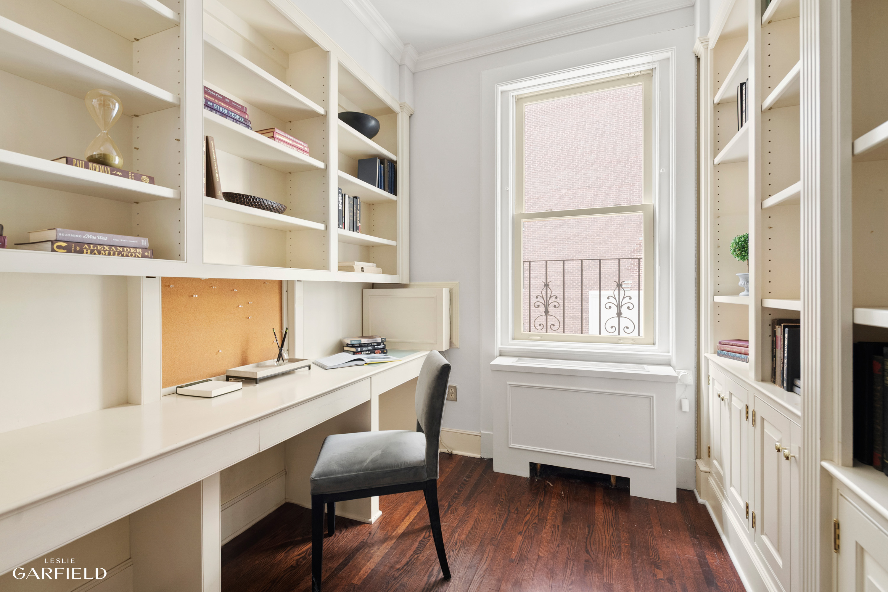 2 East 80th Street, Unit 7 Manhattan, NY 10075 - Photo 18 of 23 a workspace with a wooden floor and a window
