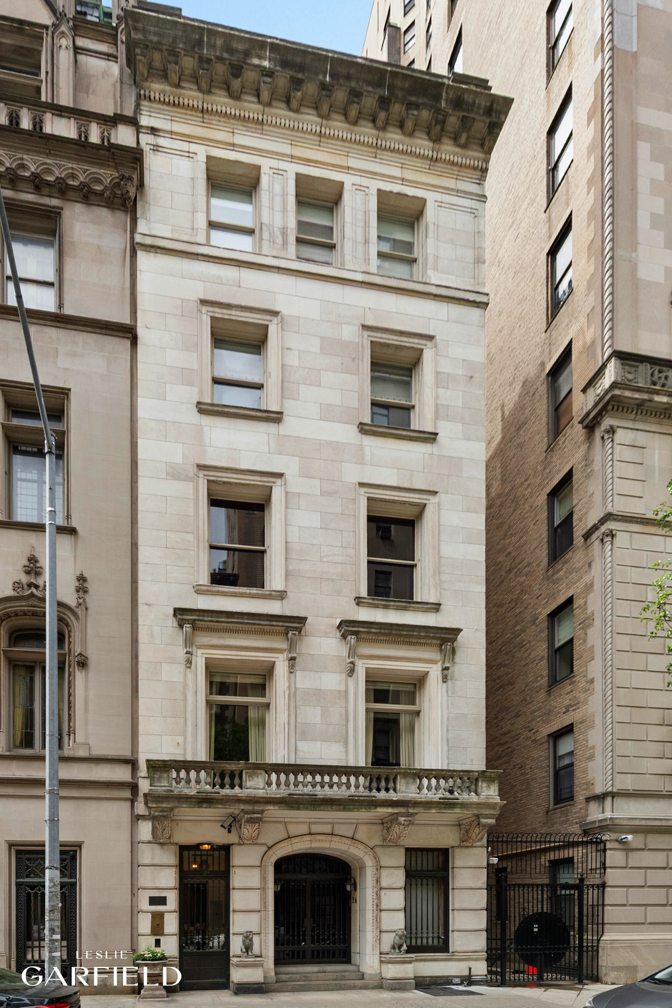 2 East 80th Street, Unit 7 Manhattan, NY 10075 - Photo 22 of 23 a front view of a building with a lot of windows