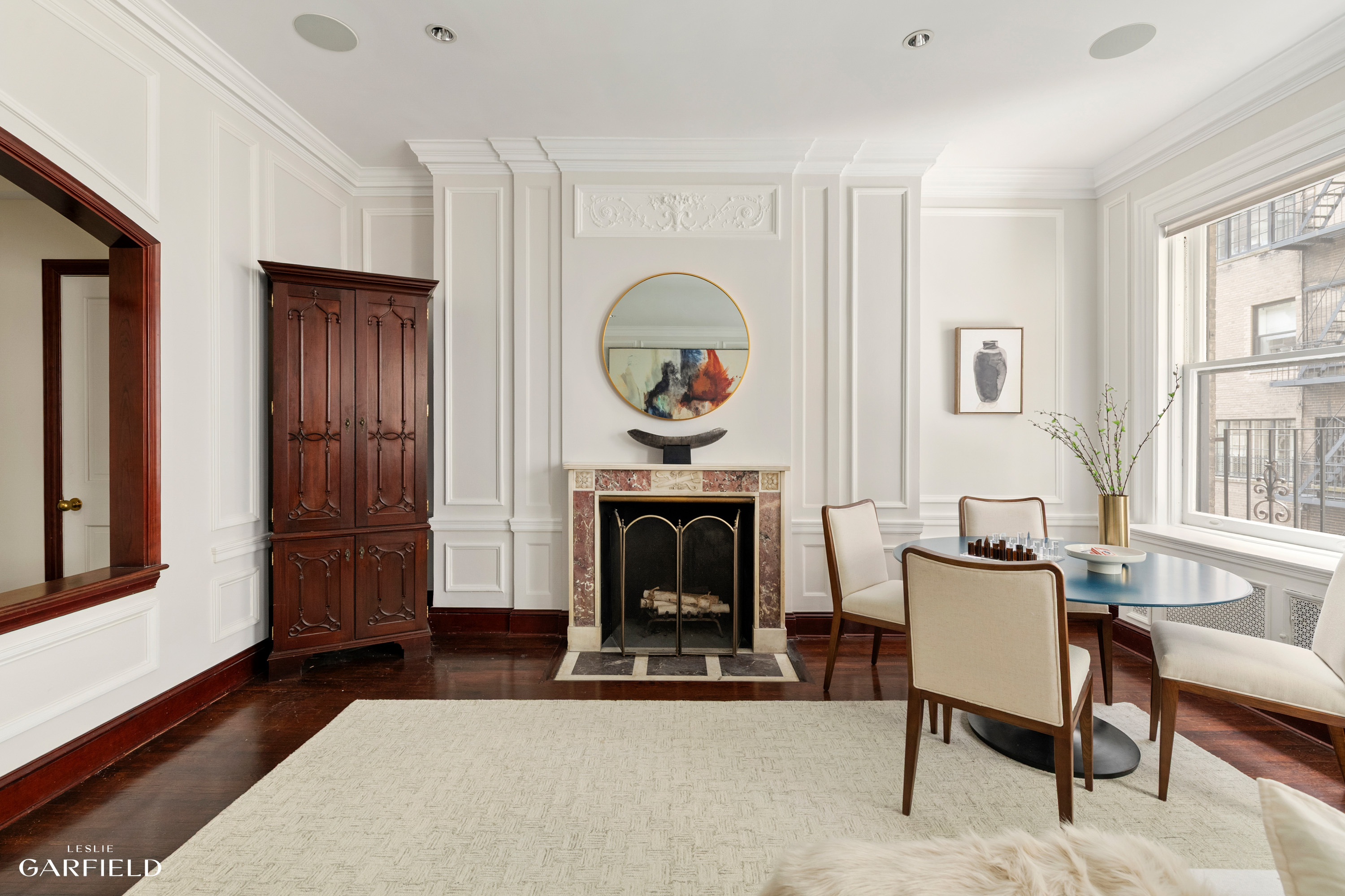2 East 80th Street, Unit 7 Manhattan, NY 10075 - Photo 3 of 23 a living room with furniture and a fireplace