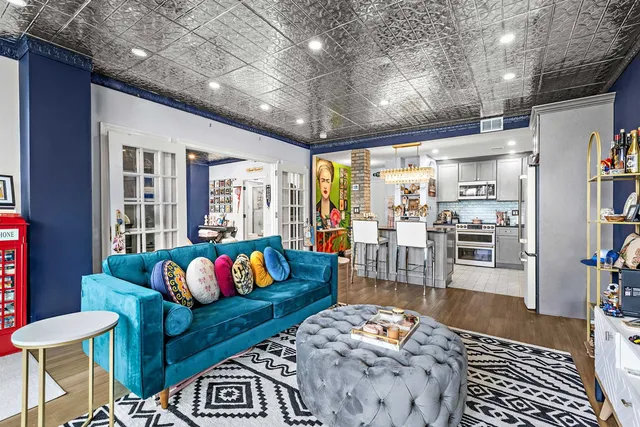 a living room with furniture and a rug