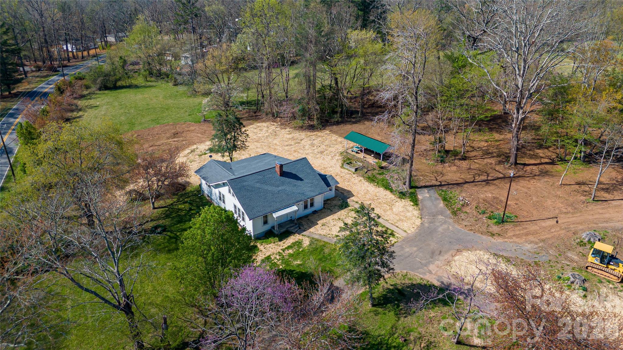a view of a garden with a house