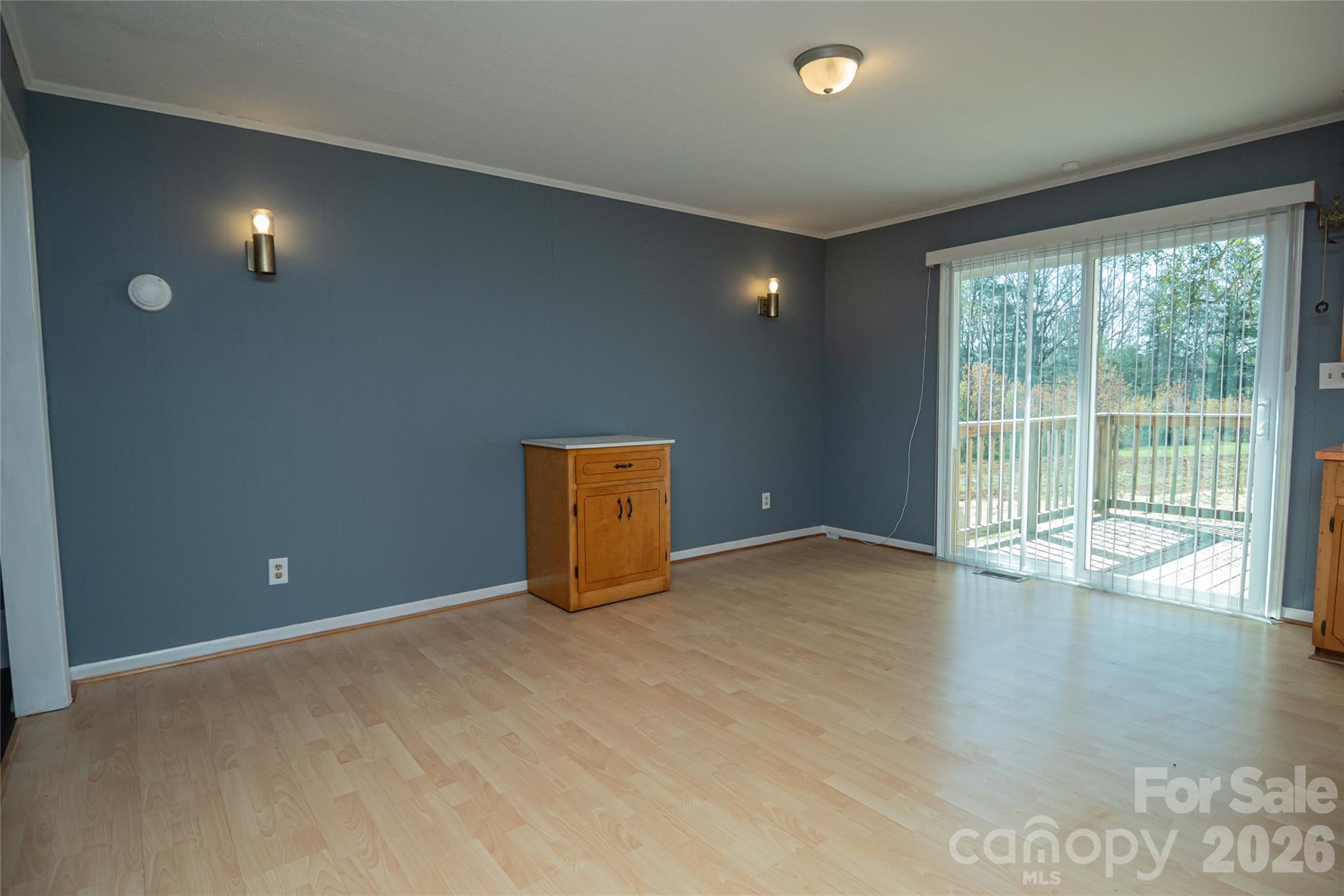 761 Amherst Road Morganton, NC 28655 - Photo 14 of 31 an empty room with wooden floor and windows