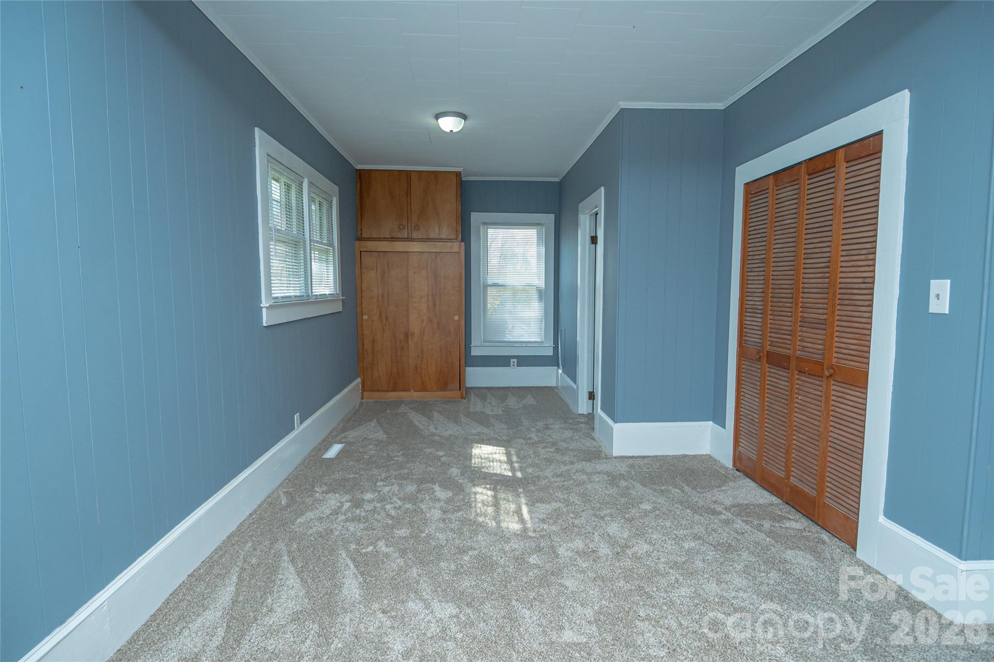 761 Amherst Road Morganton, NC 28655 - Photo 21 of 31 an empty room with windows and closet
