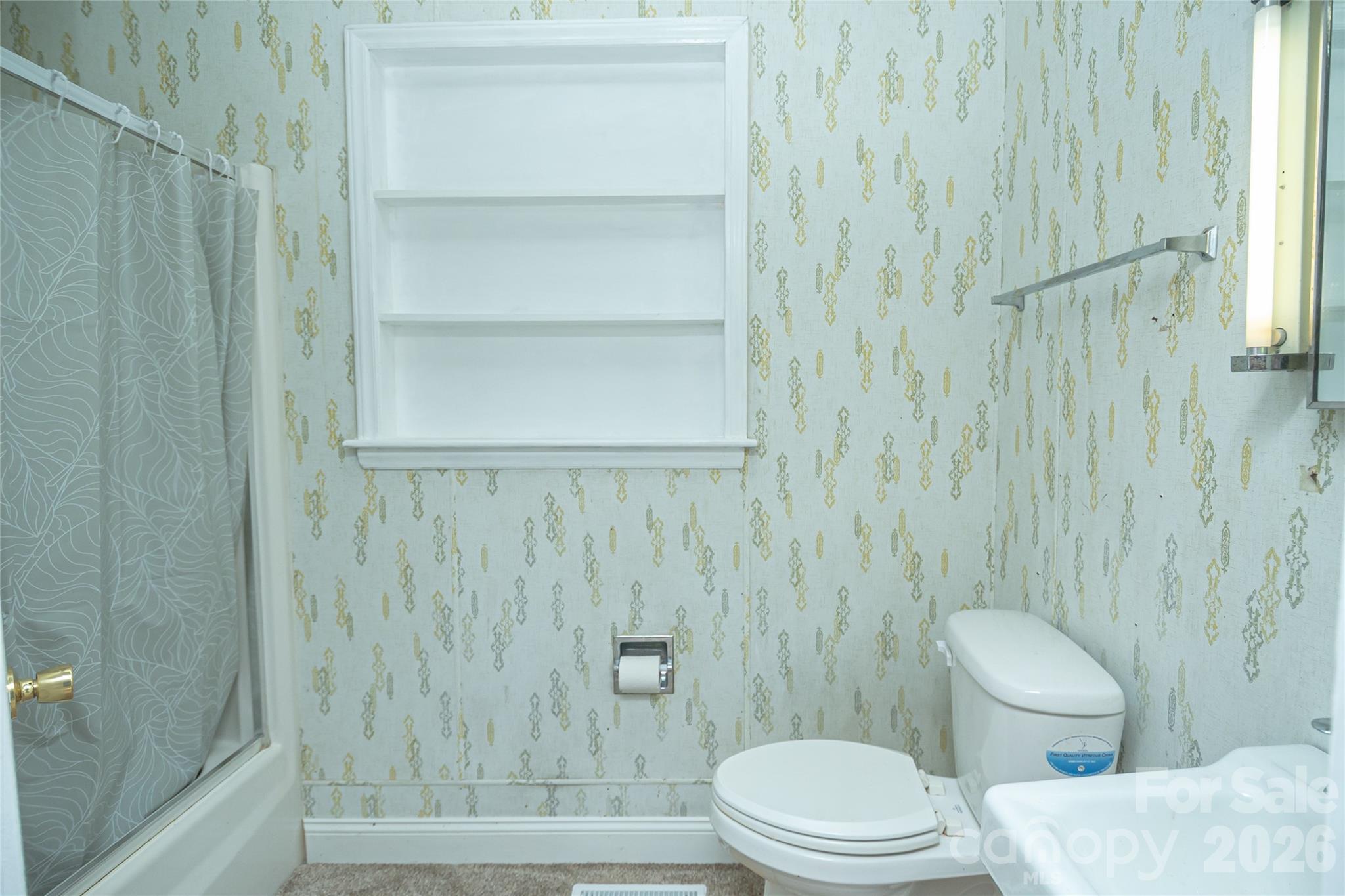 761 Amherst Road Morganton, NC 28655 - Photo 22 of 31 a bathroom with a toilet and a shower