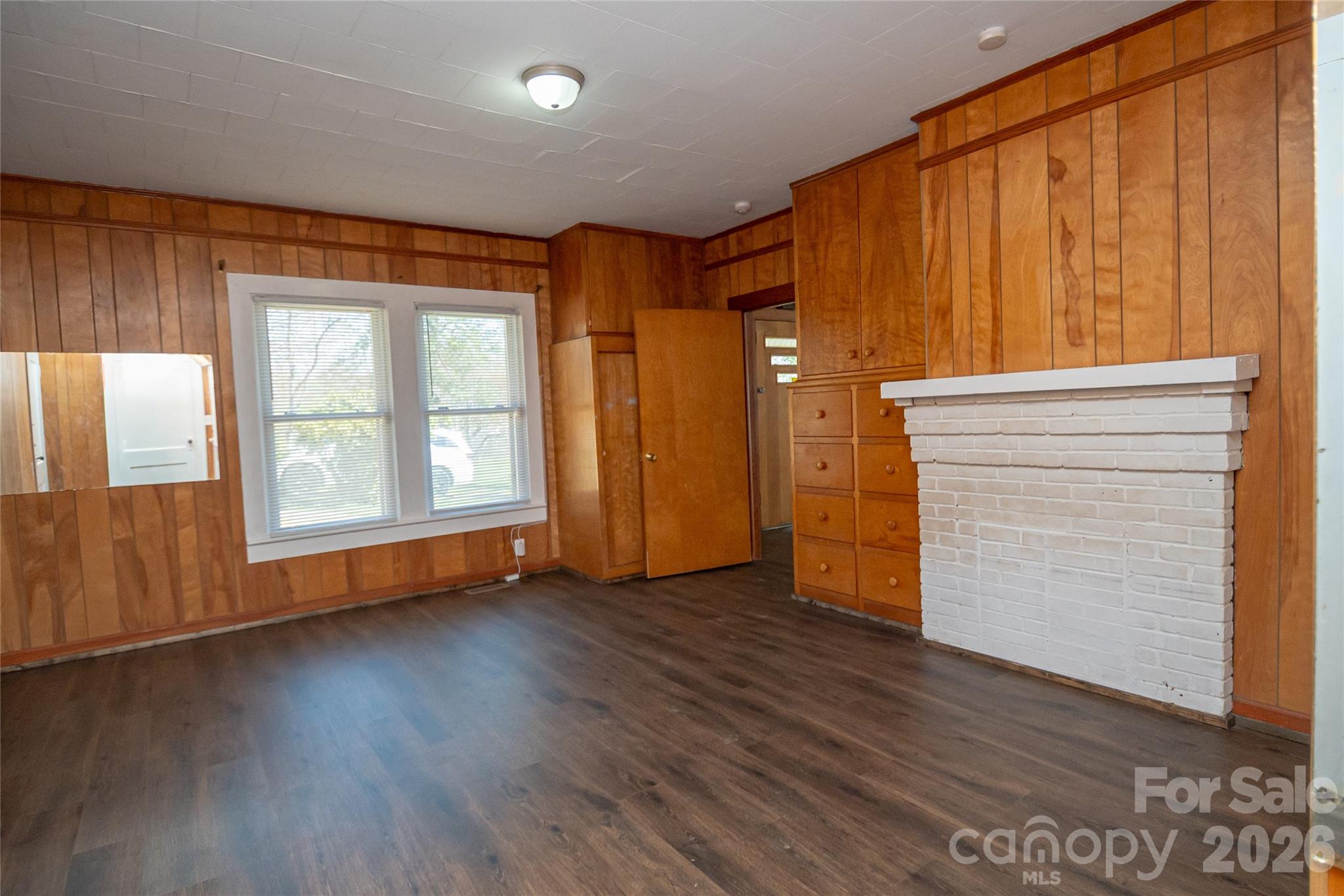 761 Amherst Road Morganton, NC 28655 - Photo 25 of 31 an empty room with wooden floor and windows