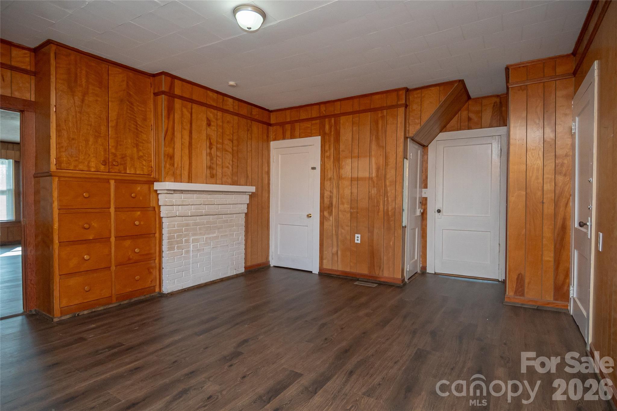 761 Amherst Road Morganton, NC 28655 - Photo 26 of 31 an empty room with wooden floor and closet area