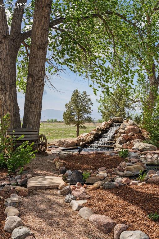 16990 Old Pueblo Road Fountain, CO 80817 - Photo 44 of 50 Waterfall Feature w/babbling brook in Front of Residence