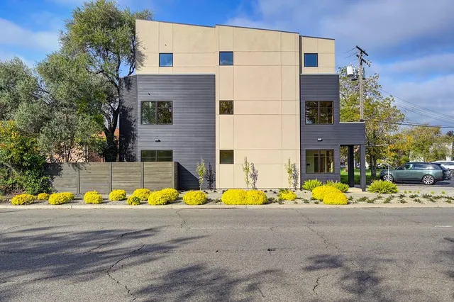 a view of a house with a snow on the road