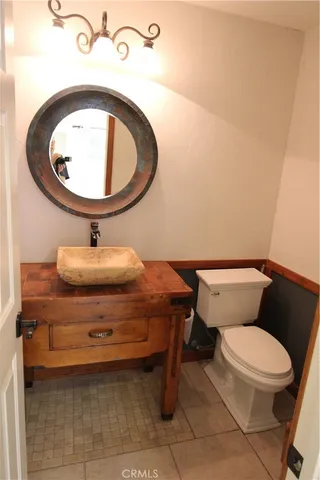 a kitchen with a cabinets sink and refrigerator