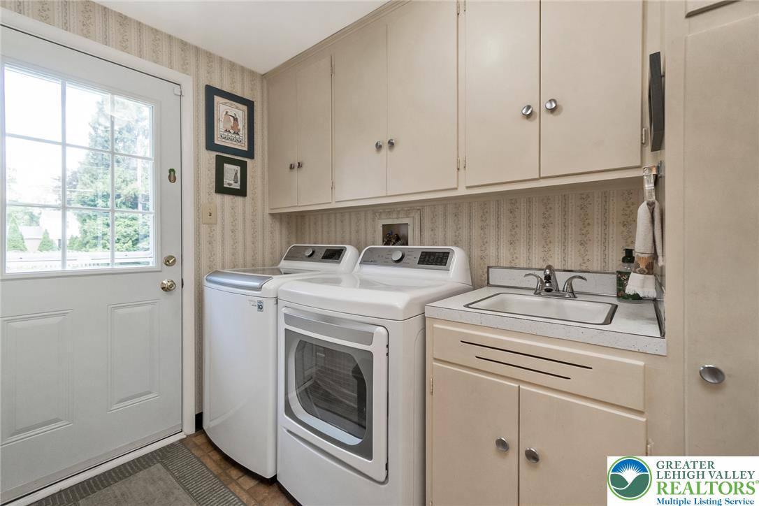 525 Wedgewood Road Bethlehem, PA 18017 - Photo 27 of 61 Laundry room has convenient access to backyard, lots of storage & sink for everyday cleanup.