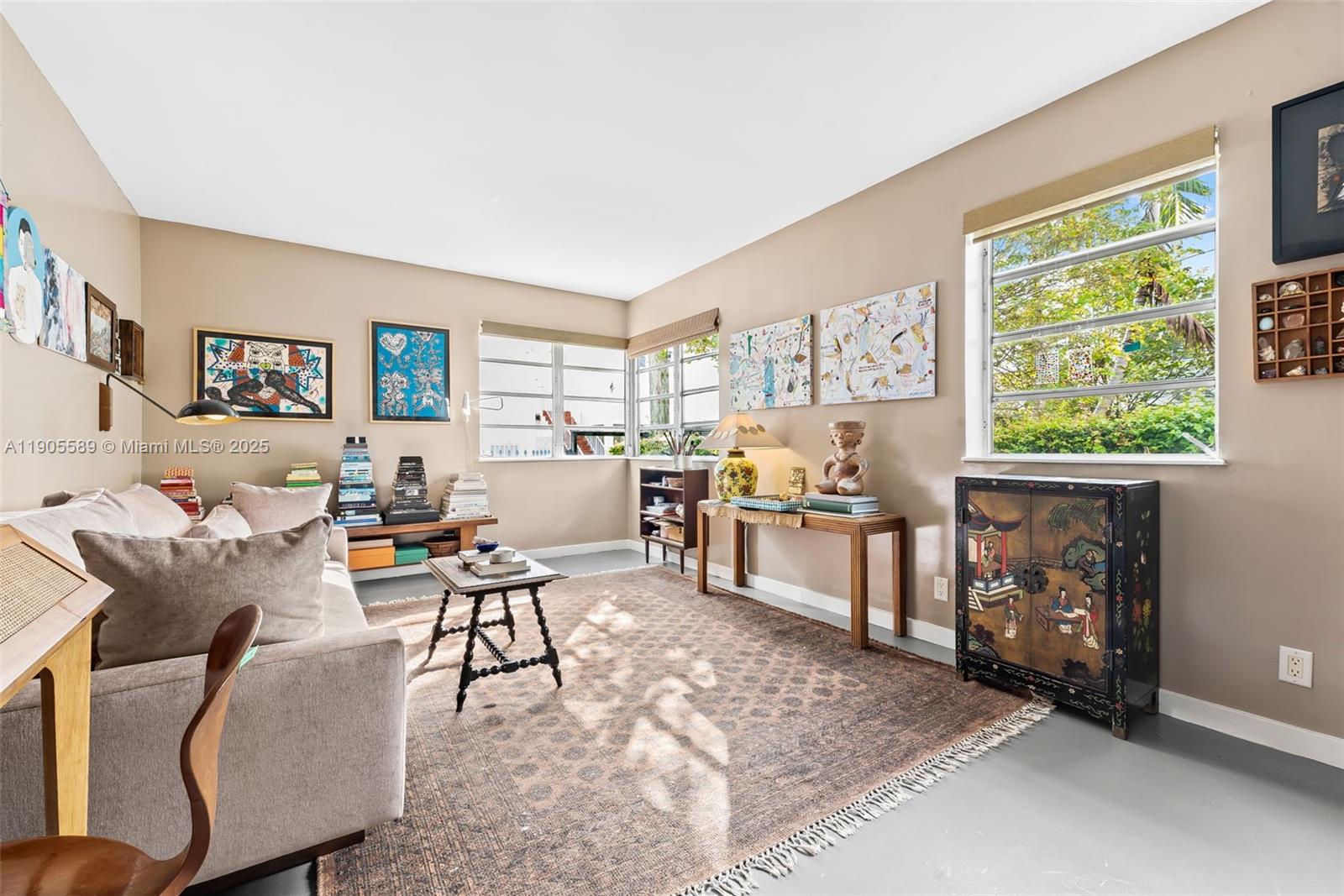 823 Jefferson Avenue, Unit 6 Miami Beach, FL 33139 - Photo 2 of 13 a living room with furniture and a window