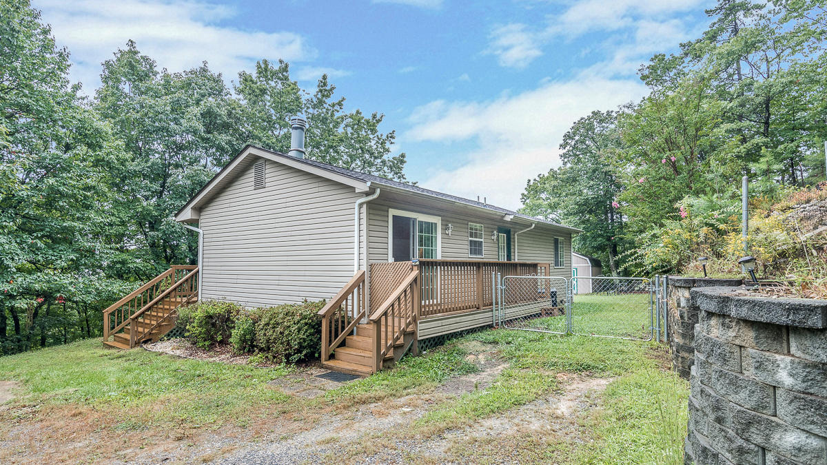 1136 Quarry Road Blue Ridge, VA 24064 - Photo 2 of 29 a view of a house with a yard