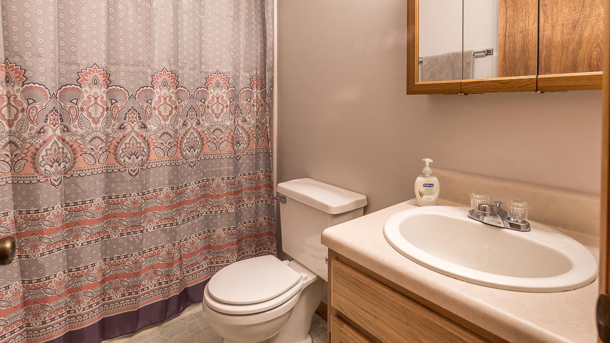1136 Quarry Road Blue Ridge, VA 24064 - Photo 15 of 29 a white toilet sitting next to a bathroom sink