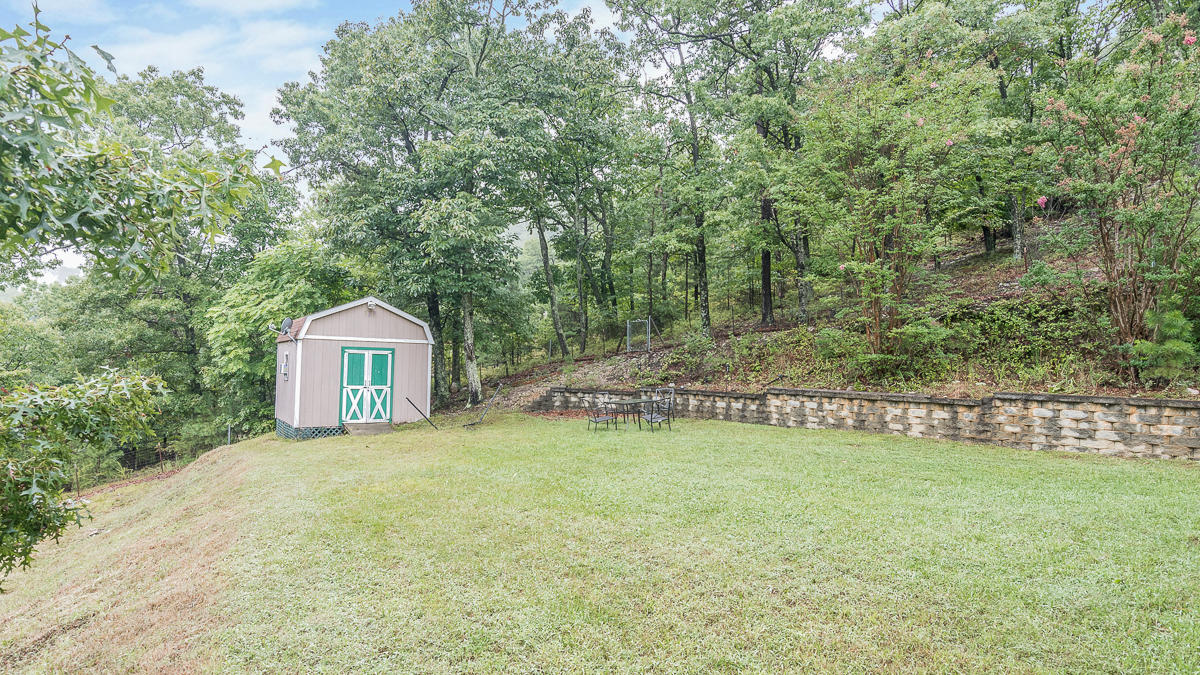 1136 Quarry Road Blue Ridge, VA 24064 - Photo 22 of 29 a view of a house with a yard and a fountain
