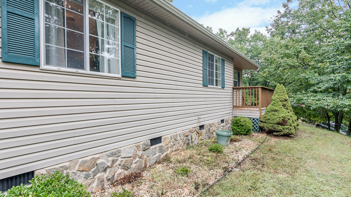 1136 Quarry Road Blue Ridge, VA 24064 - Photo 24 of 29 a view of a house with a backyard