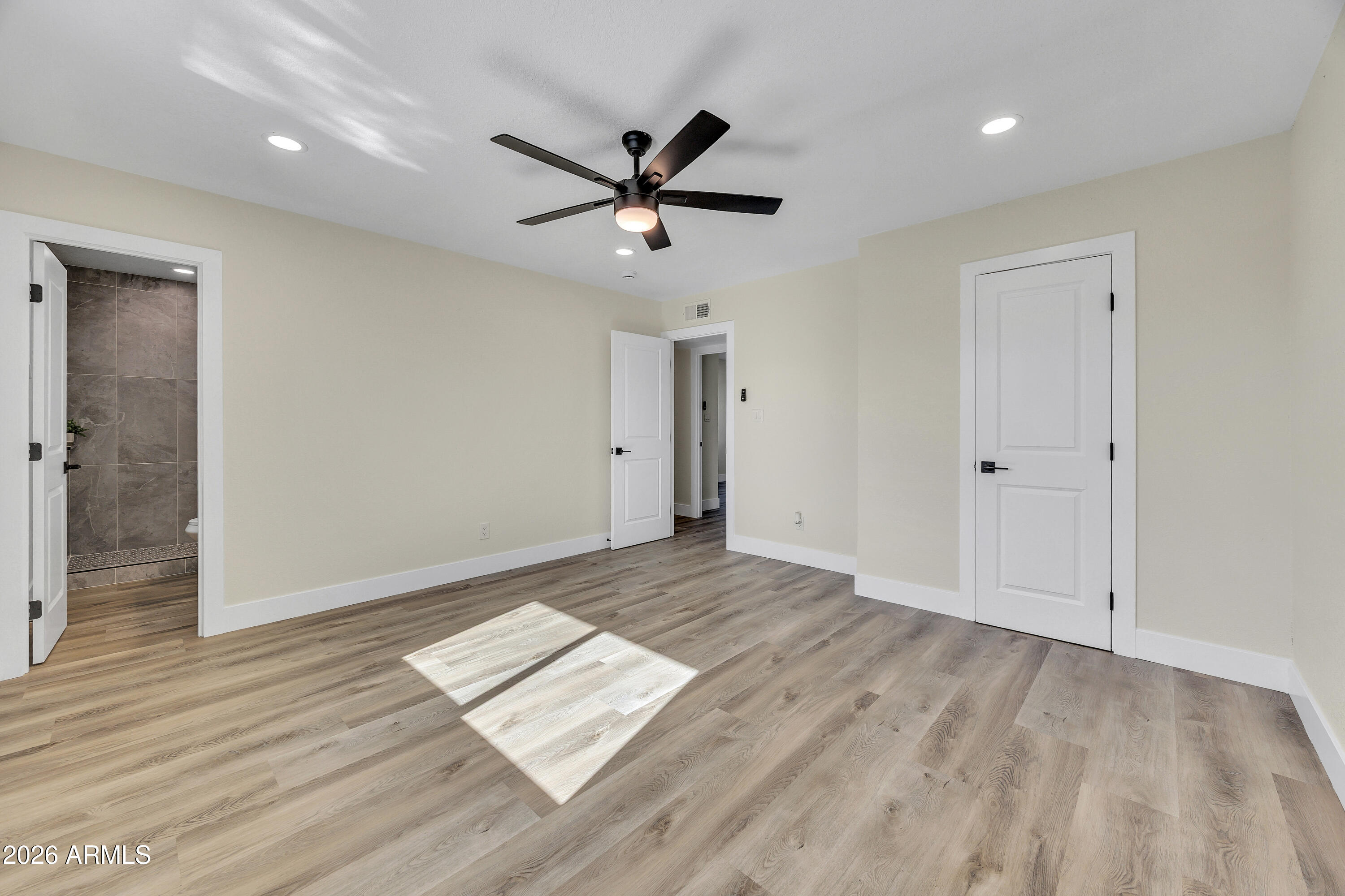2123 East Radcliffe Drive Tempe, AZ 85283 - Photo 14 of 25 wooden floor in an empty room with a window