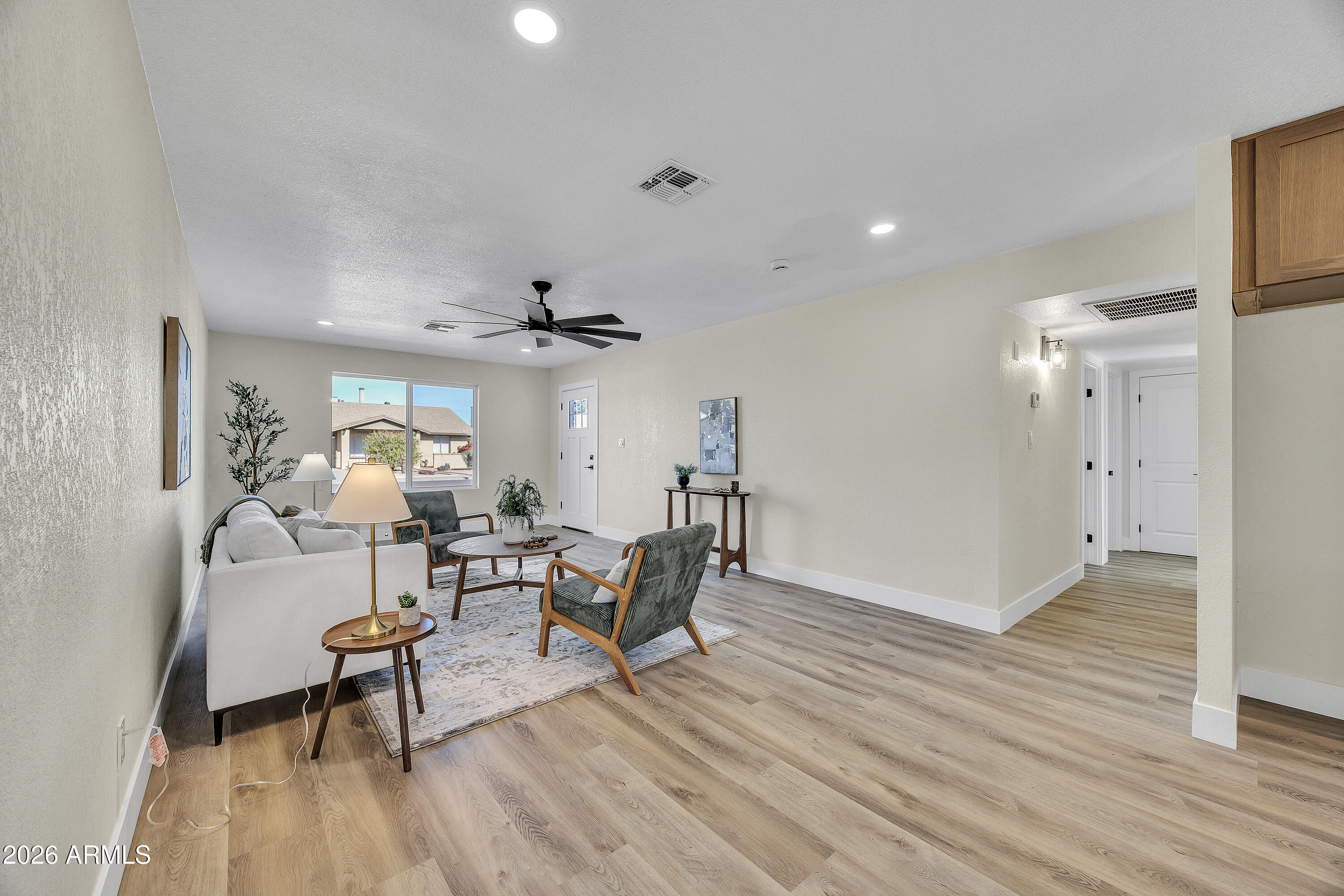 2123 East Radcliffe Drive Tempe, AZ 85283 - Photo 5 of 25 a living room with furniture and a wooden floor
