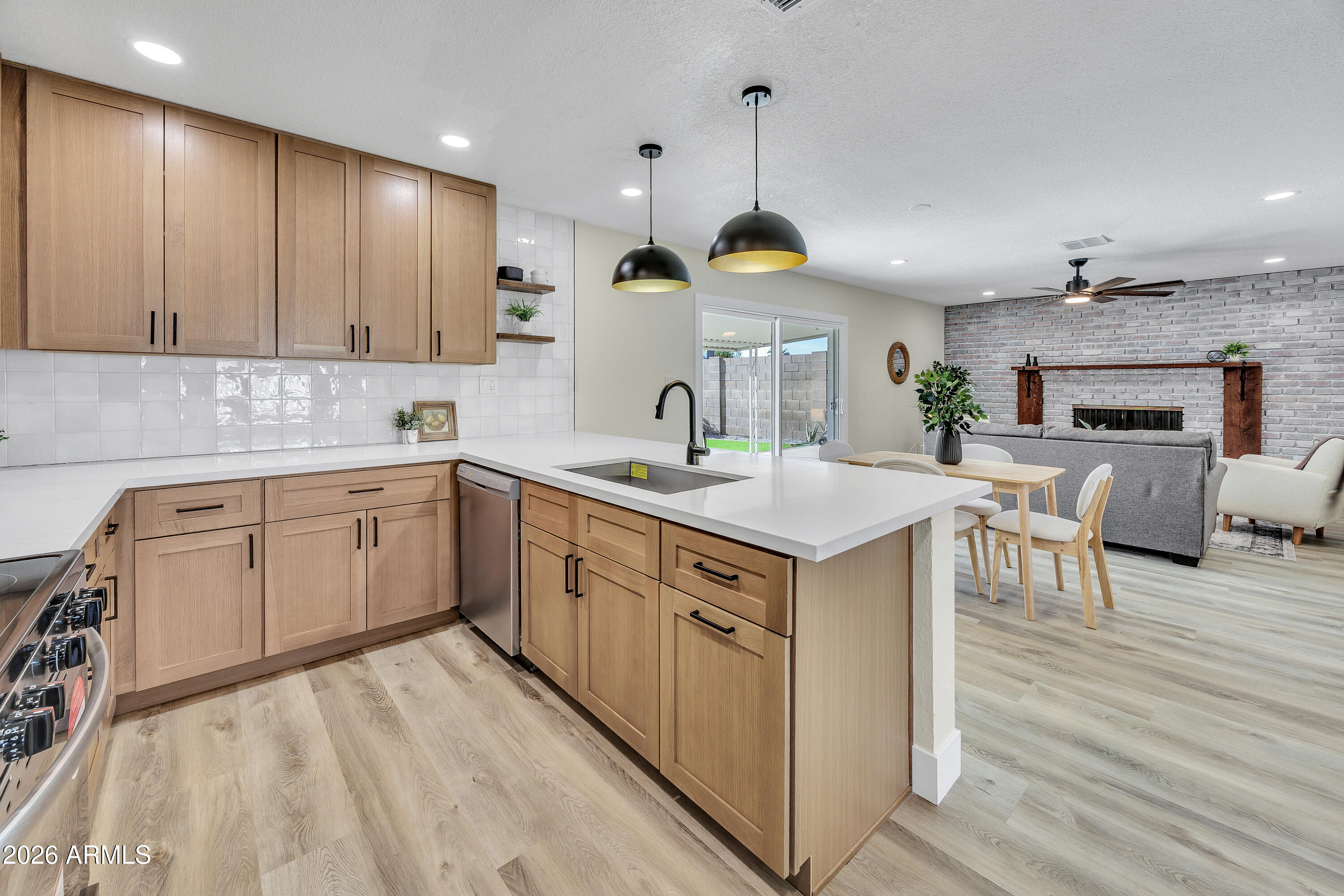 2123 East Radcliffe Drive Tempe, AZ 85283 - Photo 8 of 25 a kitchen with a sink stove cabinets and wooden floor