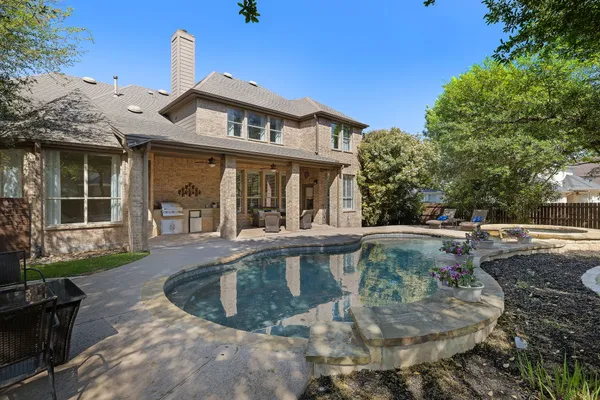 a view of a house with swimming pool