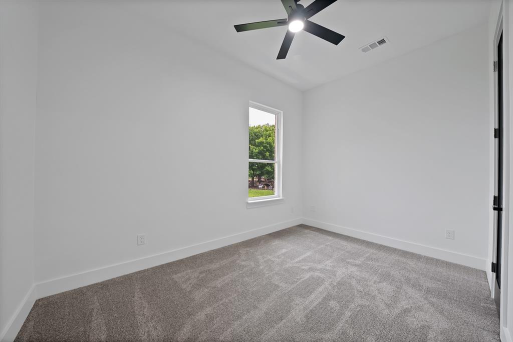 710 Gibson Road Waxahachie, TX 75165 - Photo 26 of 36 This room offers neutral colored walls and carpet, a modern ceiling fan, and a window providing natural light
