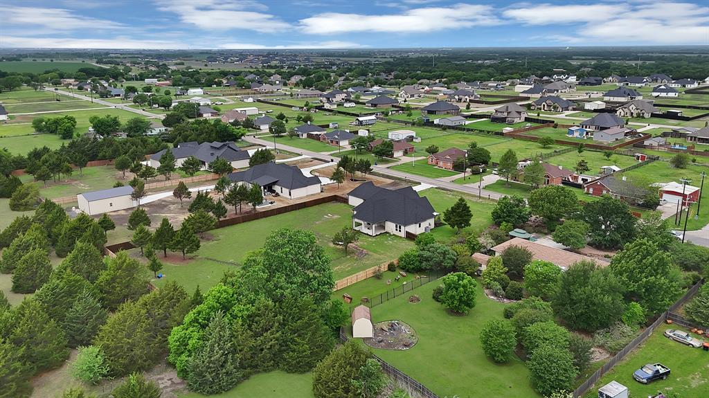 710 Gibson Road Waxahachie, TX 75165 - Photo 34 of 36 Expansive residential area featuring numerous properties with well-maintained lawns and mature trees
