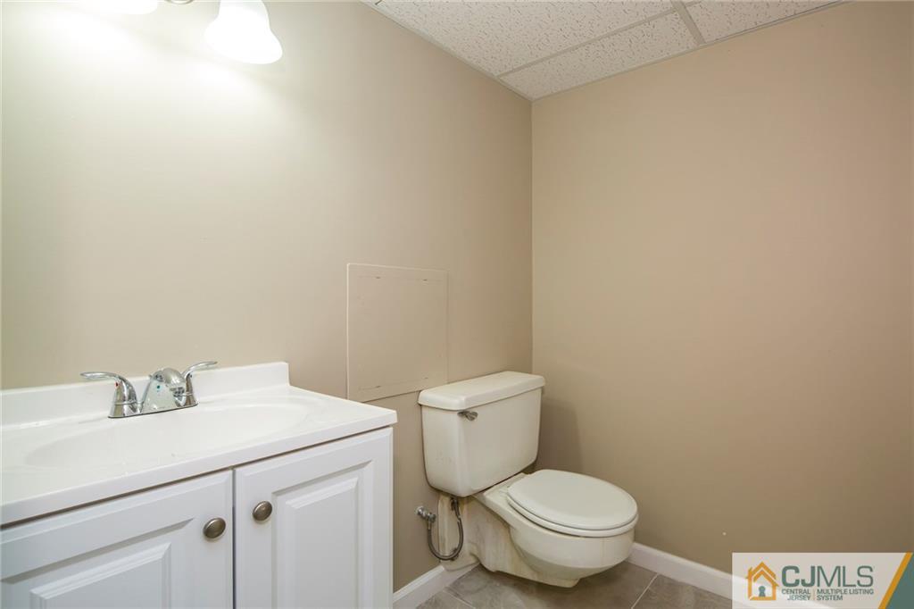 35 Purdue Road Old Bridge, NJ 08859 - Photo 20 of 21 a white toilet sitting next to a bathroom sink