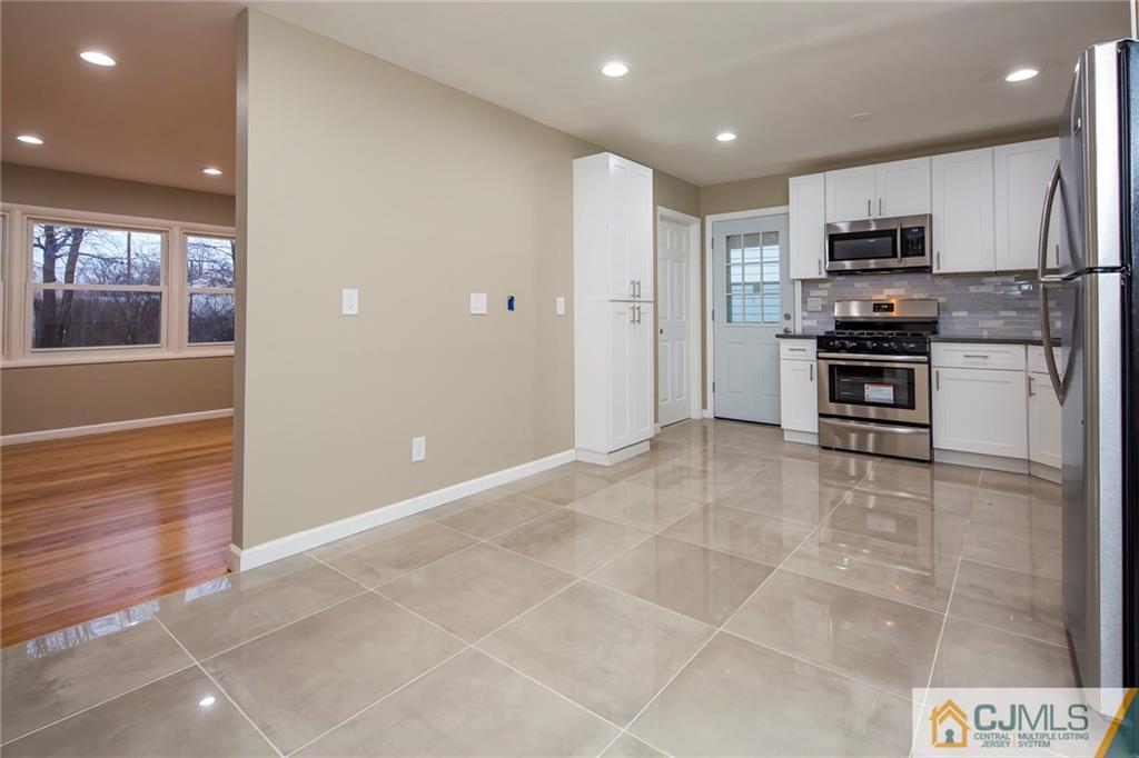 35 Purdue Road Old Bridge, NJ 08859 - Photo 6 of 21 a kitchen with stainless steel appliances granite countertop a refrigerator and a stove top oven