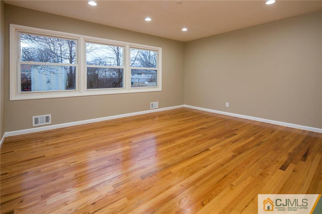 35 Purdue Road Old Bridge, NJ 08859 - Photo 9 of 21 a view of an empty room with wooden floor and a window