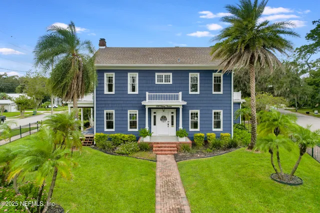 a front view of house with yard and green space