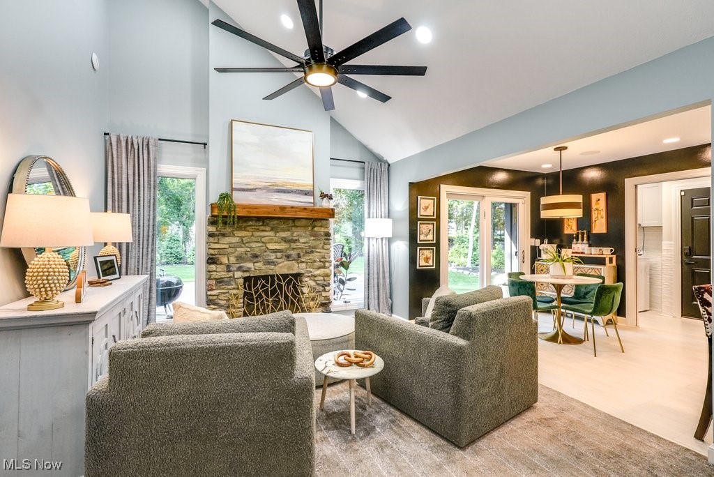1598 Graham Road Silver Lake, OH 44224 - Photo 19 of 46 Living room with light hardwood / wood-style flooring, ceiling fan, high vaulted ceiling, and a fireplace