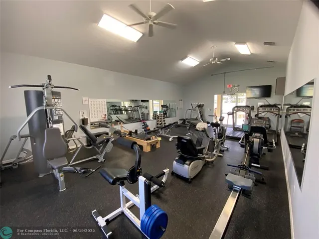 a living room with furniture pool table and a window