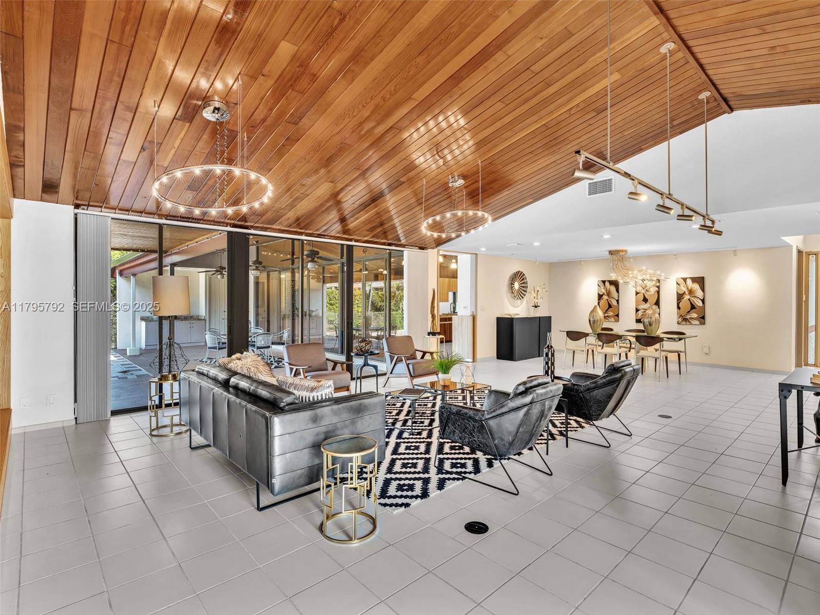 13494 Stirling Road Southwest Ranches, FL 33330 - Photo 11 of 79 a outdoor space with lots of tables a large window and furniture