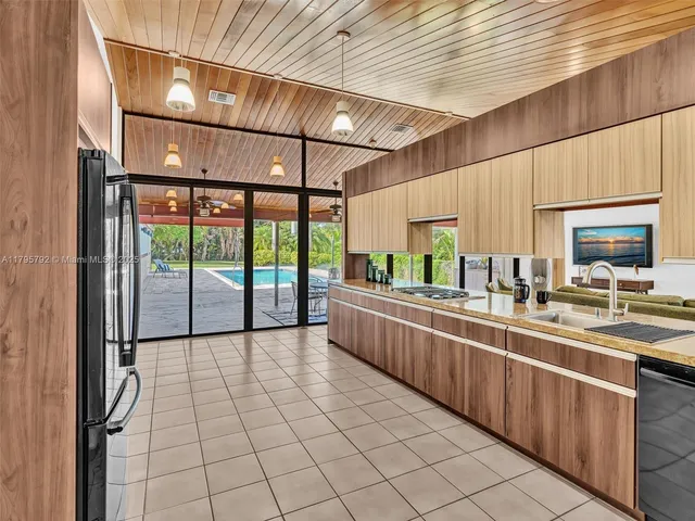 a view of swimming pool with yard and outdoor seating