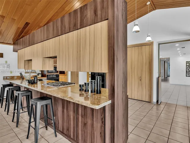 an aerial view of residential building and ocean