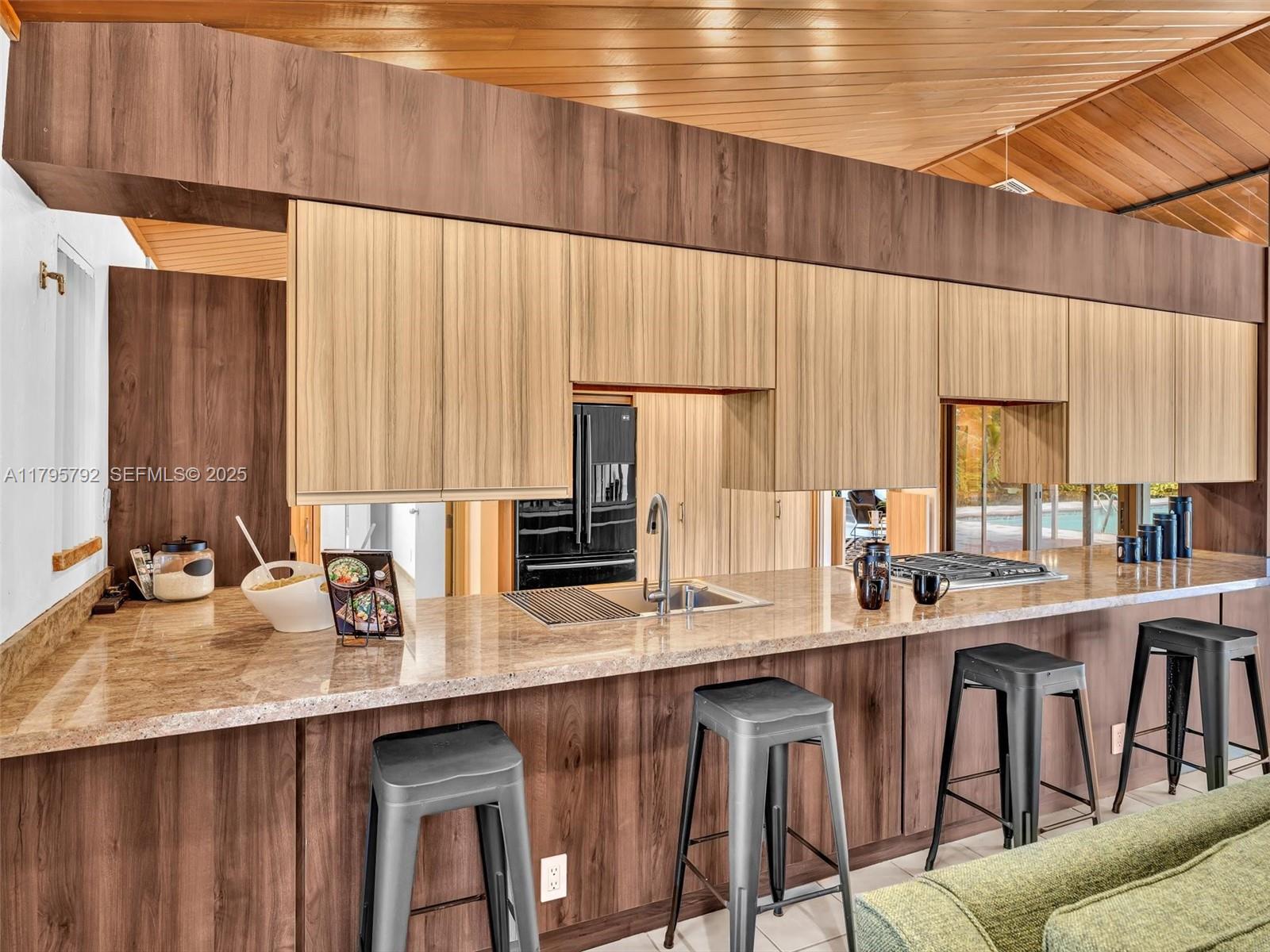 13494 Stirling Road Southwest Ranches, FL 33330 - Photo 24 of 79 a kitchen with appliances a sink and cabinets