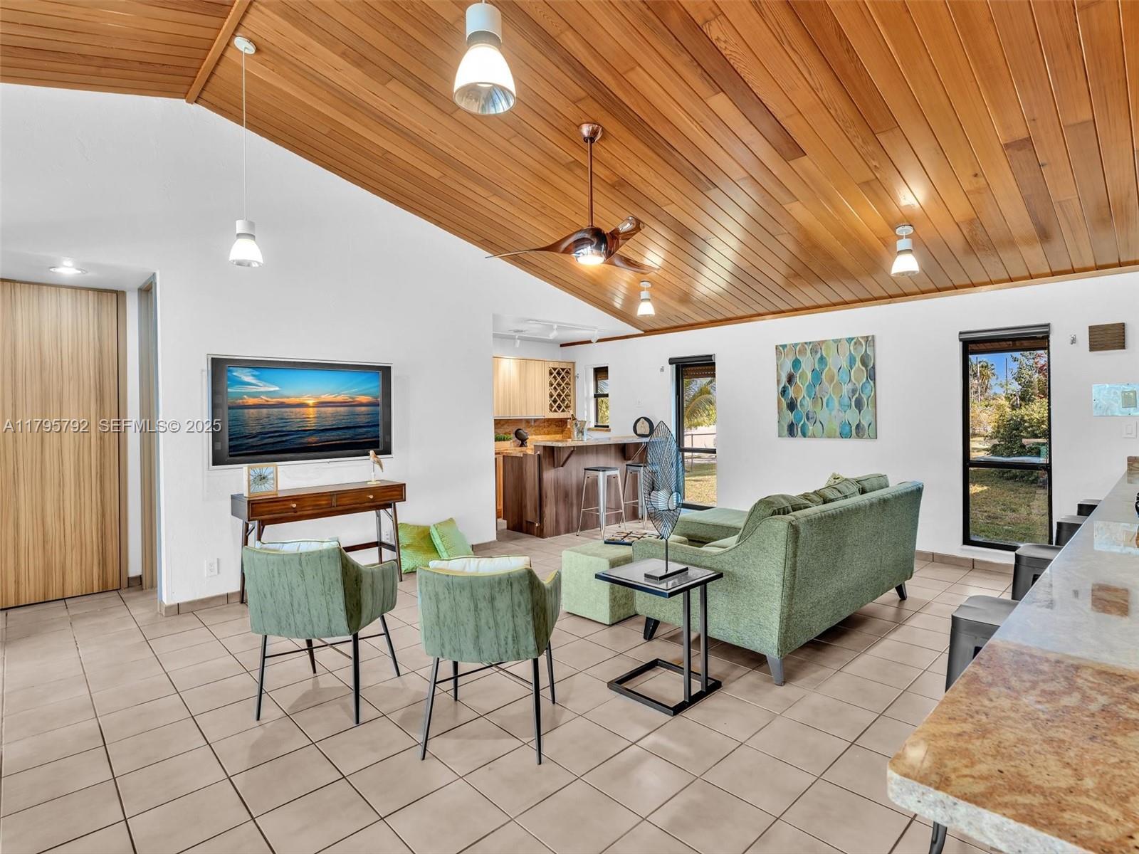 13494 Stirling Road Southwest Ranches, FL 33330 - Photo 26 of 79 a living room with furniture and a flat screen tv