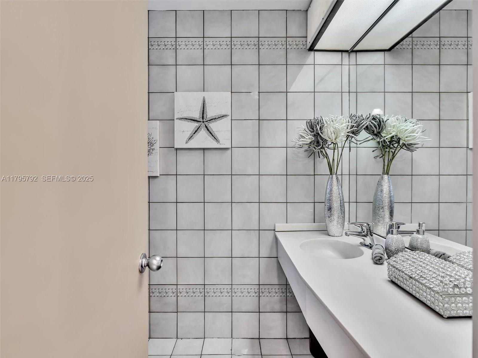 13494 Stirling Road Southwest Ranches, FL 33330 - Photo 49 of 79 a bathroom with a bathtub